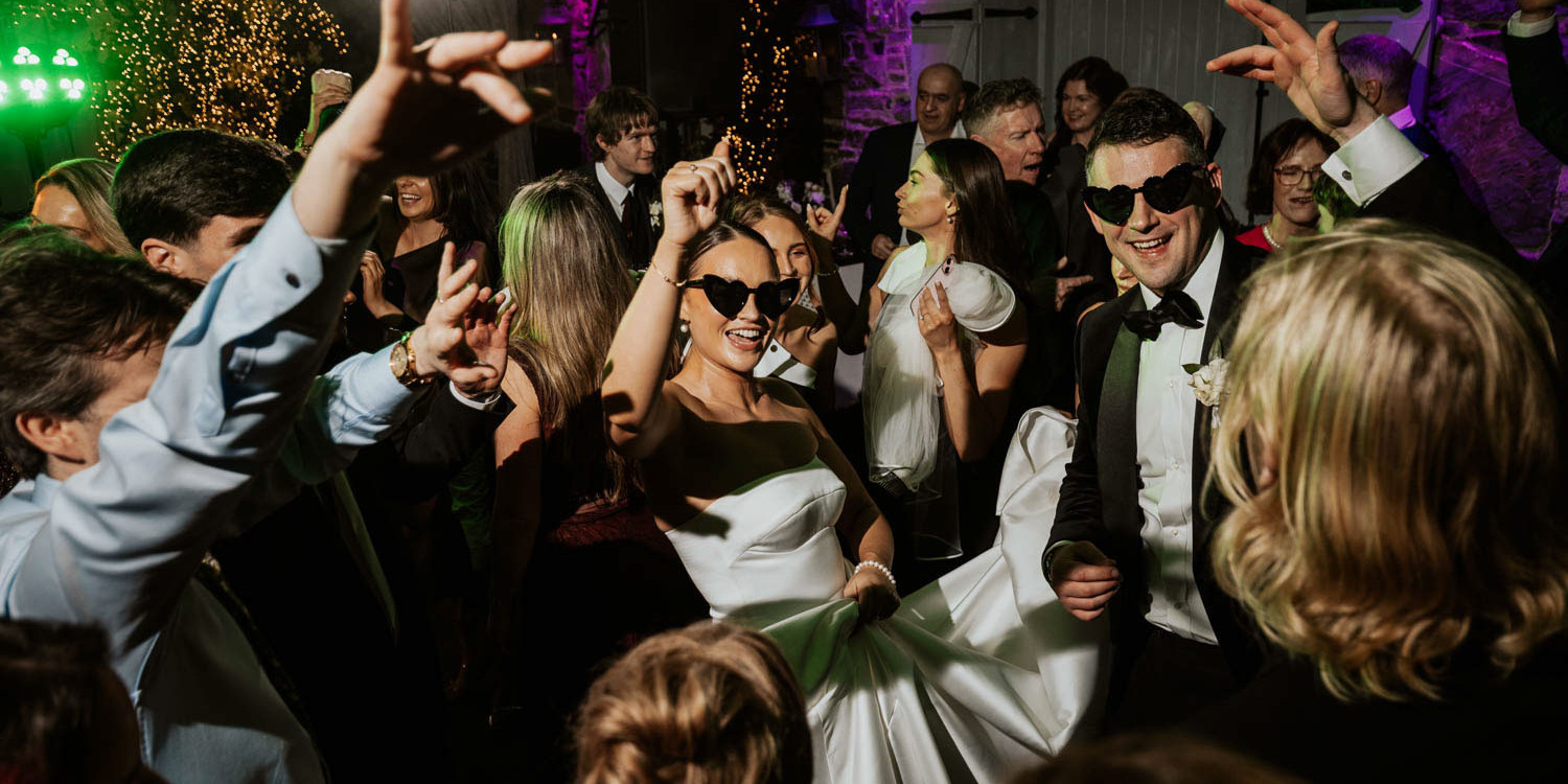 Bride and groom on the dancefloor at Ballymagarvey Village wedding in Meath.